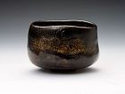 A Classic Black Raku Tea Bowl by Akazawa Seiho