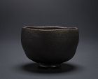 A Black Raku Tea Bowl by Samukawa Seiho