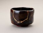 An Exceptional Antique Raku Tea Bowl with Gold Repair