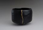 An Antique Black Raku Tea Bowl with Gold Repair