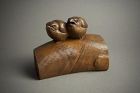 A Japanese wood okimono of two chicks by Ohno Meizan