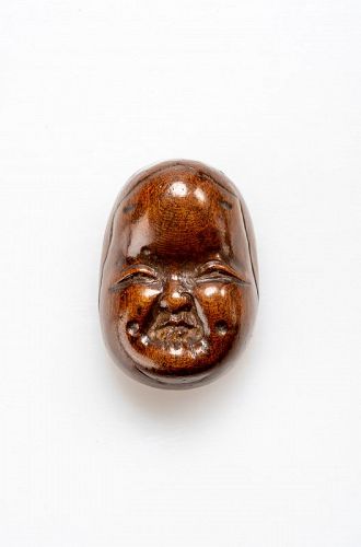 A Japanese Okame wood mask