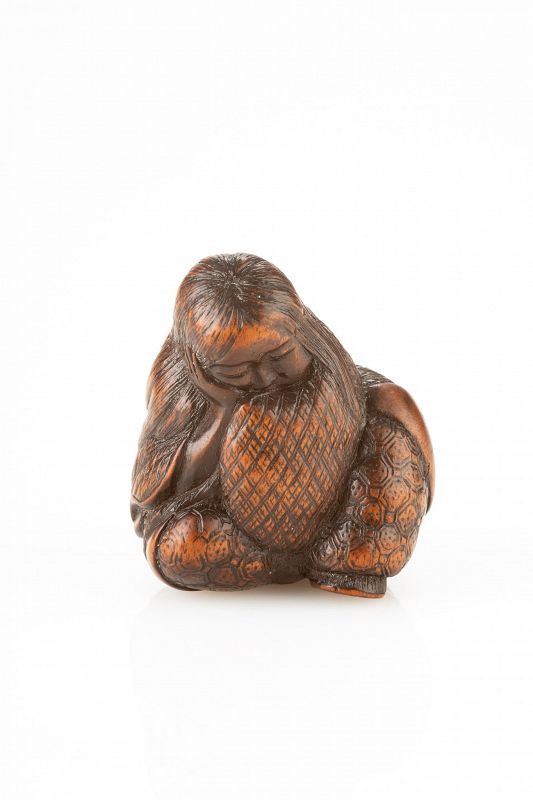 A Japanese boxwood netsuke of Shojo