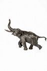 A Japanese large bronze okimono depicting a running elephant