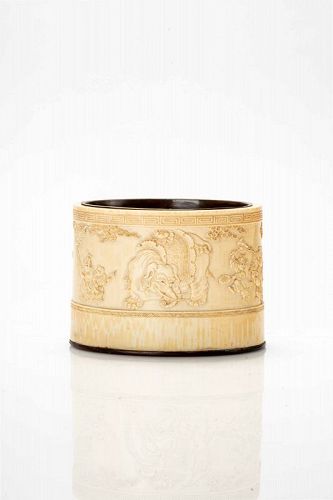 An ivory low relief vase with festive characters and elephant