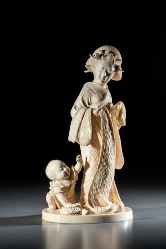 Ivory okimono from the Tokyo School depicting a mother with a child