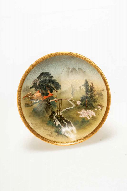 A Satsuma bowl decorated with a striking landscape