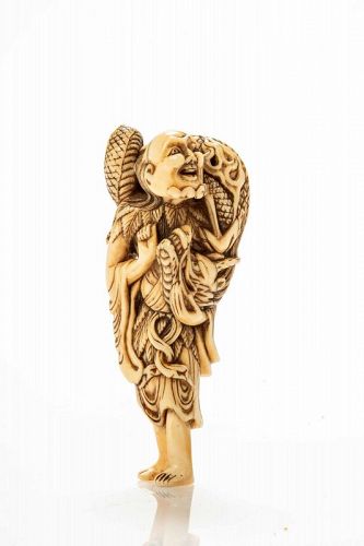 An ivory netsuke depicting Chinnan Sennin, an immortal hermit