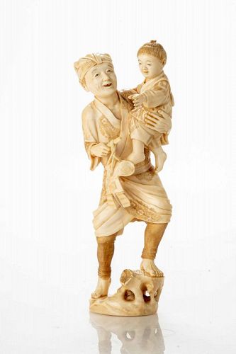 An ivory okimono depicting a scene of daily life