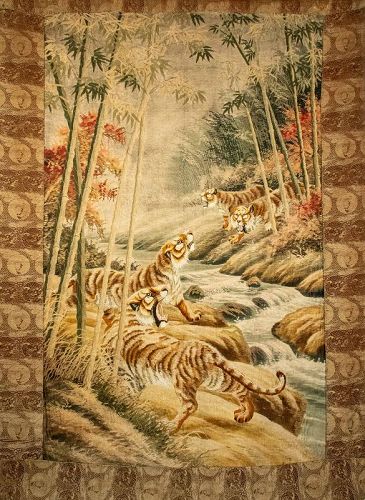A Japanese tapestry depicting four tigers