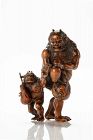 A boxwood okimono depicting two walking Oni