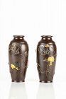 A pair of iron vases decorated with inlays