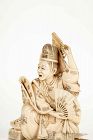 An ivory okimono depicting a dancer from Noh theater