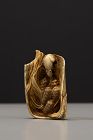 An ivory netsuke depicting a mouse with millet ears