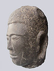 A rare Khmer black stone Buddha head, Pre-Angkor 4thC