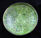 Large and rare Islamic pottery dish w green glace, 11th. cent.