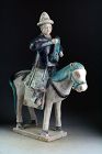 Superb & XL Ming Dynasty pottery horse rider attendant, 1678-1644