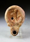 Early Roman pottery oil lamp with Amor and workshop mark, 2nd. cent!