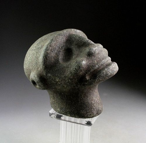An Artful stone head of the Taino Culture, 1000-1300 AD.