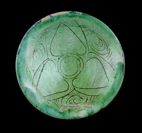 Superb carved Islamic dish w green glaze, Seljuqs, ca. 1100-1200 BC