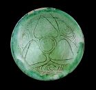 Superb carved Islamic dish w green glaze, Seljuqs, ca. 1100-1200 BC