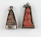 Pair of very nice early Thai silver encased Buddha amulets