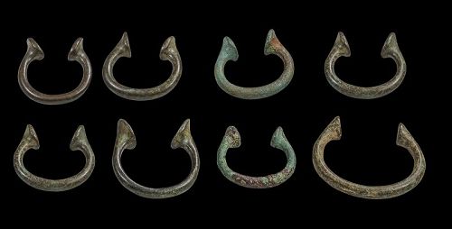 Collection of 8 early Nigerian bronze currency Manillas, 16th.-18th. c