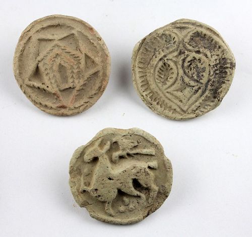 Set of three ceramic pottery seals, Islamic 7th.-10th. century AD