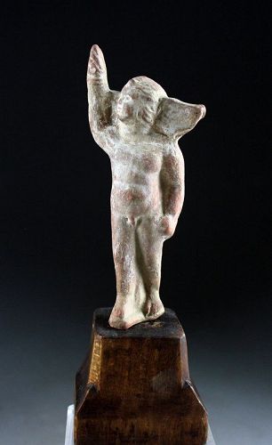 Lovely early Roman terracotta figure of Eros with torch, 1st. cent. AD