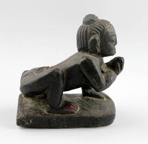 Attractive Indian stone figure of Krishna as butterthief, 19th. c.