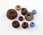 Lot of 9 scarce Viking beads in Amber, stone and faiance, 9th. cent.