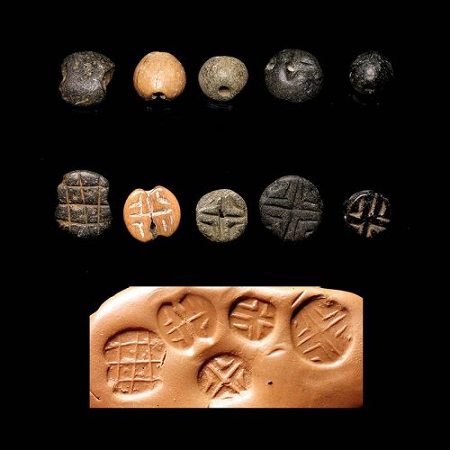 5 Early stone stamp seals, Uruk period, Mesopotamia, 4th. mill. BC