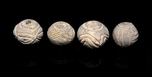 4 XL carved ceramic beads or spindles, Egypt, c. 3rd.-2nd. mill. BC