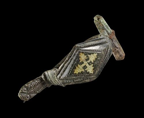 Intact bronze fibula w inlaid enamel cross & animal head, 6th. cent AD