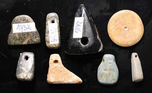 Lot of 8 larger amulets in stone, bone and faience, 7th.-1th. mill. BC