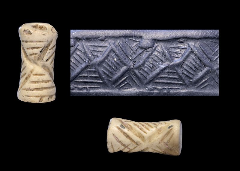 Finely carved concave Mesopotamian white cylinder seal, Jemdet Nasr
