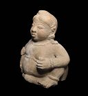 Important XL stoneware figure of the infant Buddha, Java, Majapahit