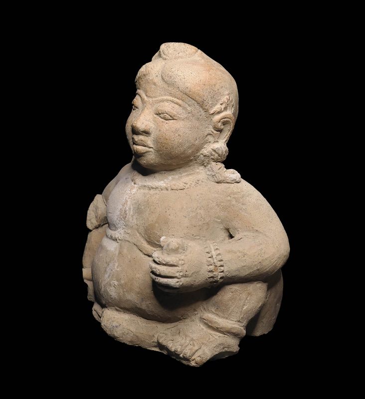 Important XL stoneware figure of the infant Buddha, Java, Majapahit