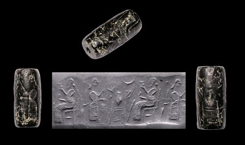 Blackstone cylinder seal w Ashur or Great King drinking, Neo-Assyrian