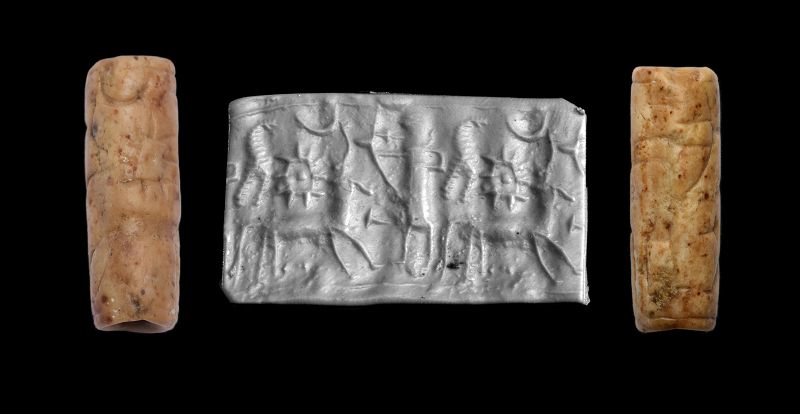 Attractive Assyrian orange stone cylinder seal, 14th.-12th. cent. BC
