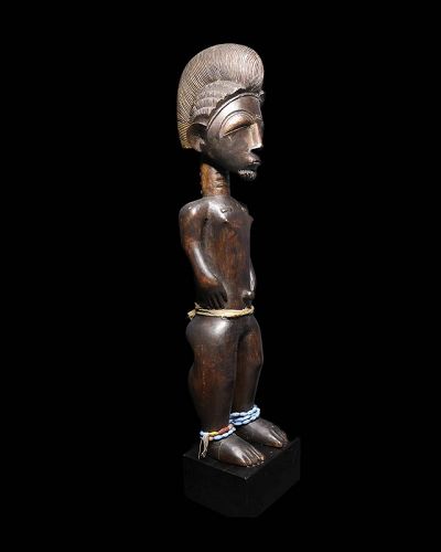 Superb quality early wooden Baulé Male Figure ‘Blolo Bian’