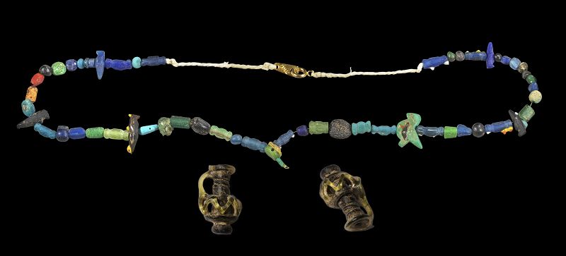 Lovely Roman miniature glass jug and glass beads and amulets