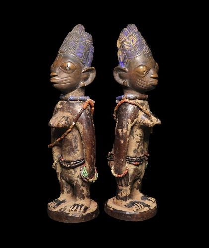 Early wooden Yoruba Ibeji female twin figures, Nigeria, c.19th. cent.