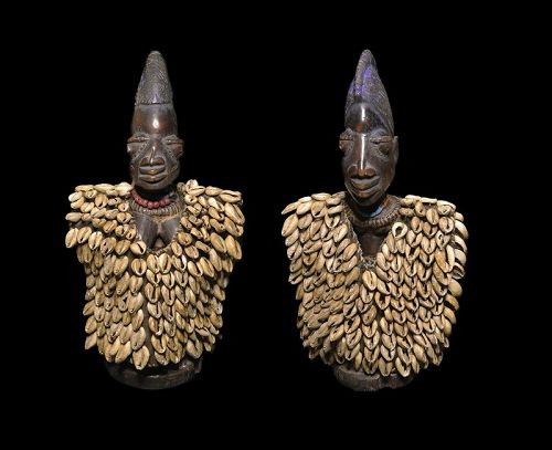 Wooden Yoruba Ota Awori twins w Kaori shell capes, Nigeria, 20th. c.
