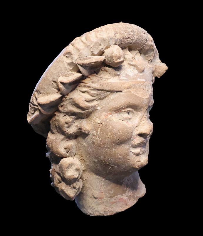 Large charming hellenistic terracotta head of a girl, 3rd. cent BC