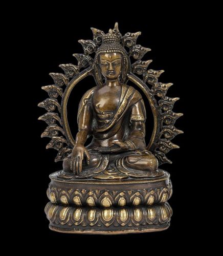 Nepalese seated bronze buddha with flaming Halo, 19th. century