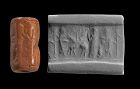 Attractive Redstone cylinder seal, Old Babylonian, 2002 - 1594 BC.