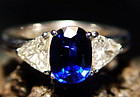 Ceylon Blue Sapphire flanked by 2 Trilliants 18K. Gold