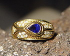 Solid 18K. Gold Ring with Blue Sapphire & Diamonds