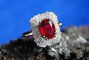EXCEPTIONAL PIGEON BLOOD OVAL RUBY AND BAGUETTE DIAMOND RING